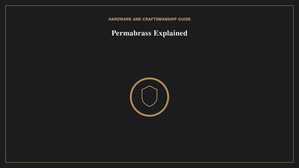 Permabrass Hardware Explained: Hermès’s Anti-Tarnish Finish Illustration of a brass toned ring with a shield motif representing Permabrass anti-tarnish finish
