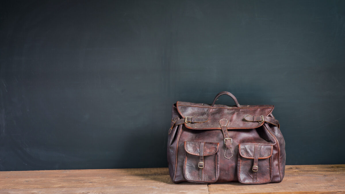 Worn vintage leather handbag showing natural aging and patina over time