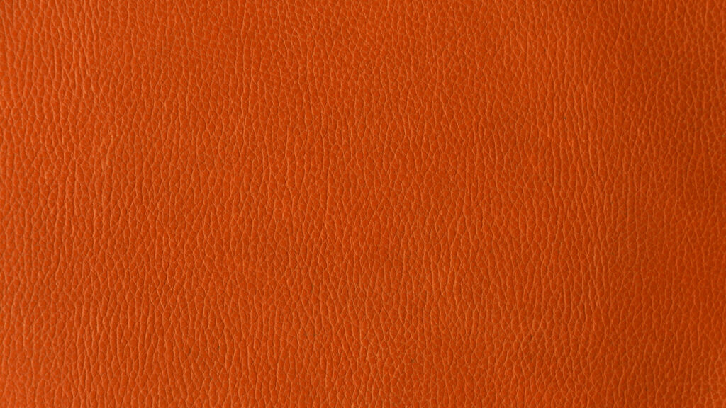 Water Damage on Hermes Barenia Leather: Prevention & Repair Close-up of smooth vegetable-tanned leather texture