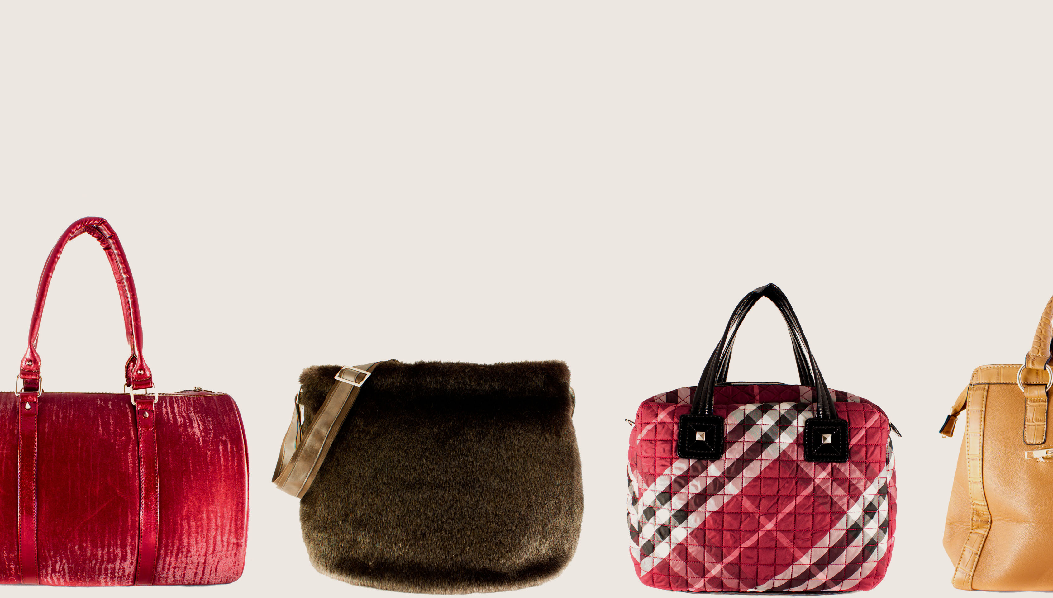 Row of structured leather handbags in different sizes, illustrating the scale differences between Birkin 25, 30, and 35