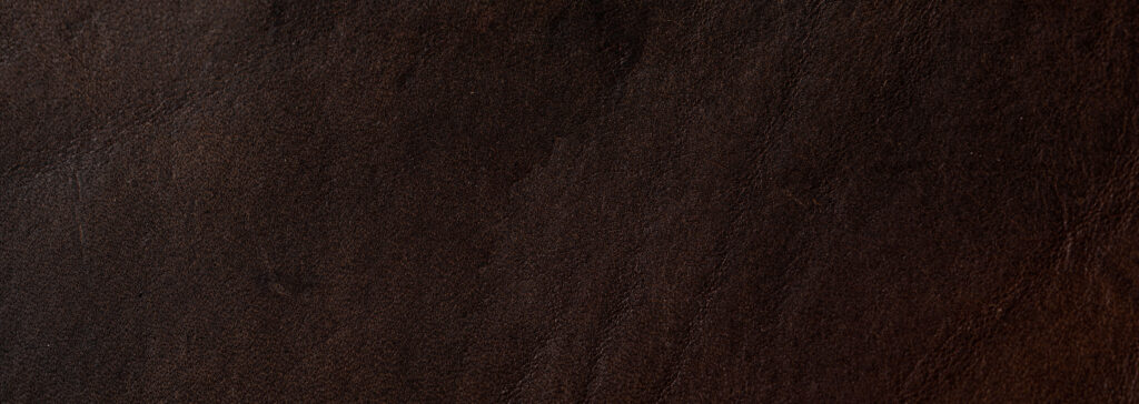What Does “Chevre” Actually Mean? A Glossary of Hermès Goat Leathers Close-up of fine-grain leather texture, illustrating the goat leather known in Hermes terminology as Chevre