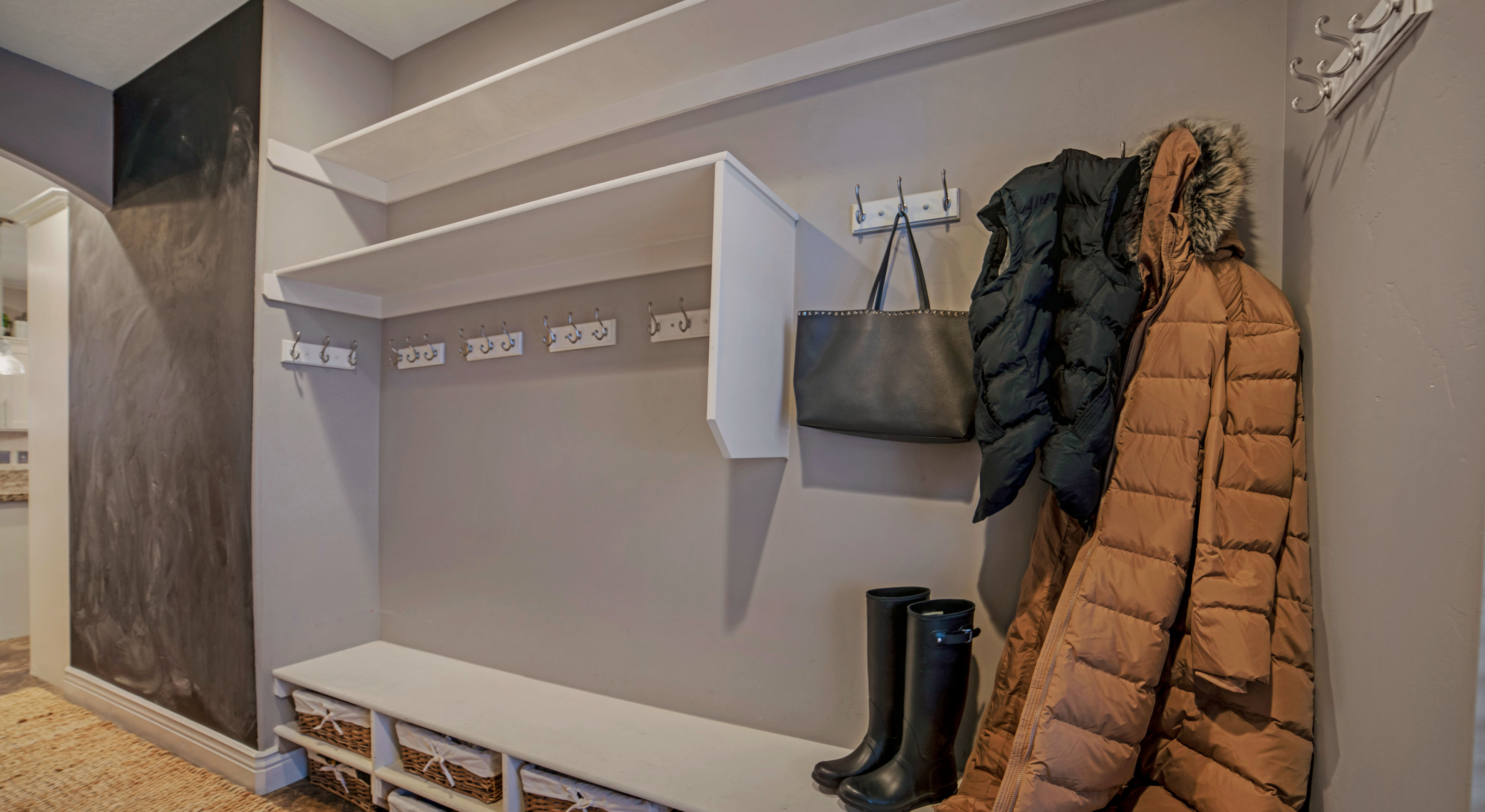 Organized closet shelving with bags stored neatly, representing correct long-term storage that preserves bag shape