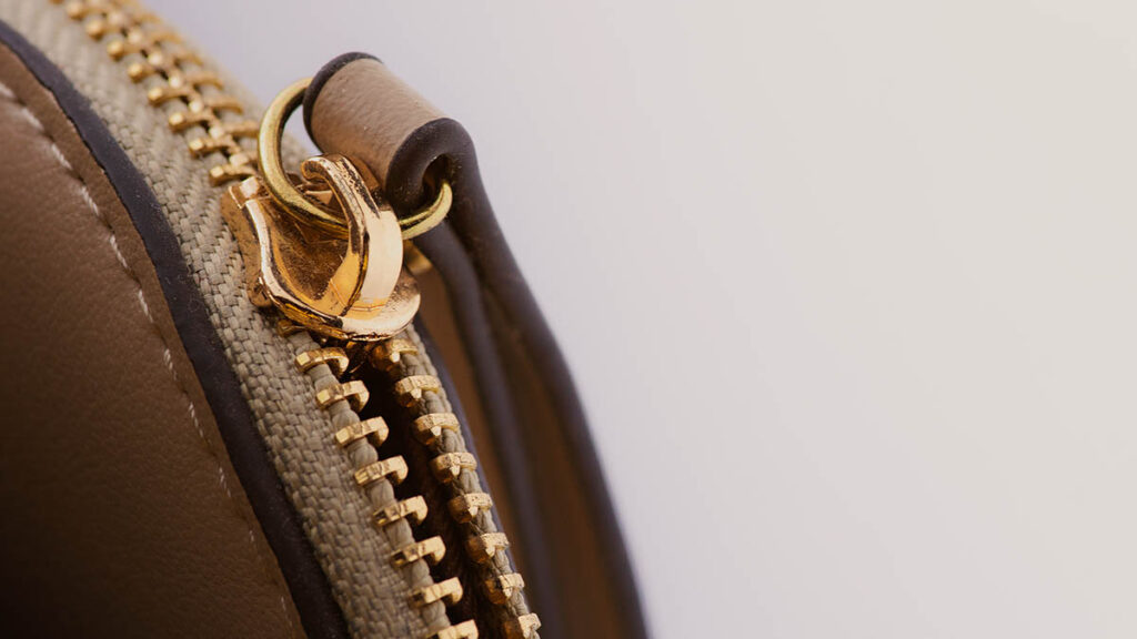 How to Fix Corner Wear on Hermes Epsom Leather Close-up of a leather handbag corner and hardware, illustrating the area most prone to Epsom leather corner wear