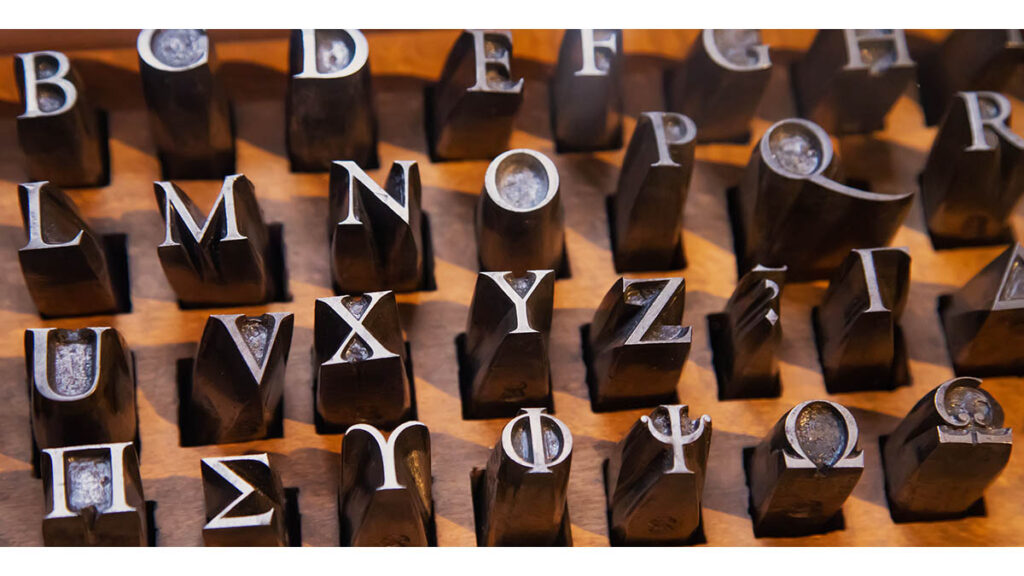 Close-up of precisely stamped metal lettering, representing the interior date stamp examined for signs of alteration