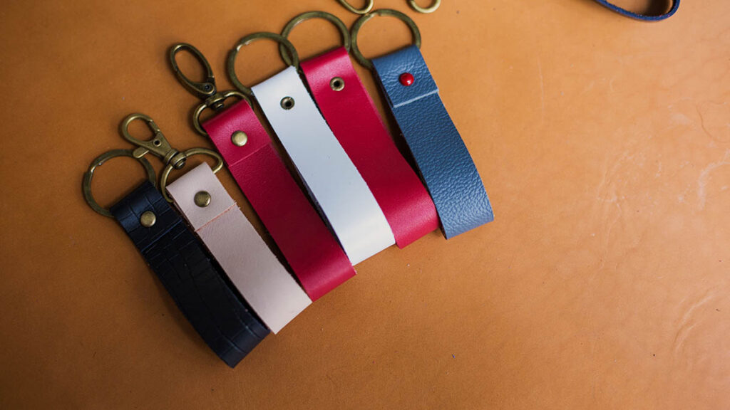 Close-up of a handcrafted genuine leather keychain and charm