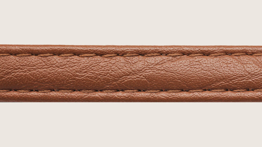 Hermes Blind Stamp Location Changes in 2026 Close-up of a genuine leather strap showing the grain where a Hermes blind stamp would be located
