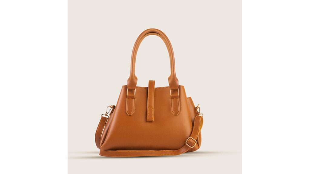 Best Hermès Bag Size for Petite Frames A small, compact leather handbag, representing the proportionally scaled sizes best suited to petite frames