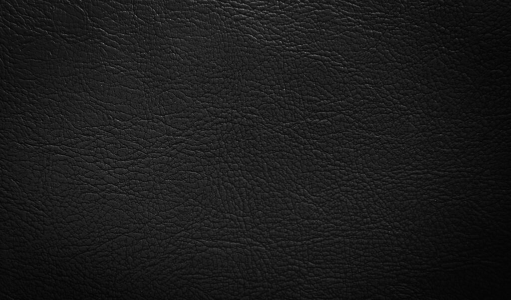 Hermes Swift vs Box Calf Leather: Scratch and Scratch Recovery Close-up of smooth black calfskin leather, illustrating the surface that shows scratches differently on Swift versus Box Calf