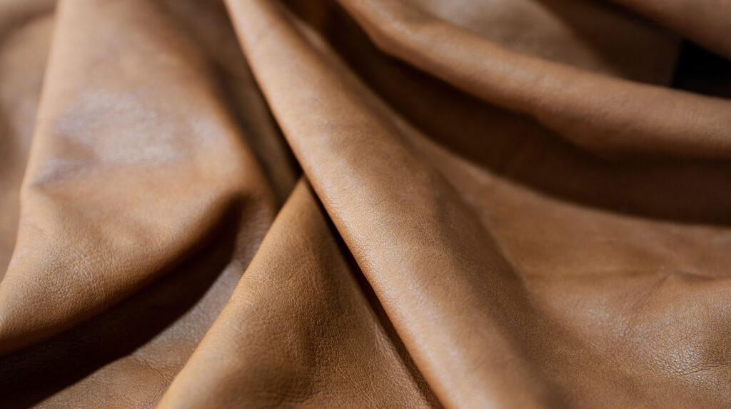 Clemence vs Negonda: Soft Leather Showdown Soft leather laying in relaxed folds, illustrating the supple drape compared between Clemence and Negonda leathers