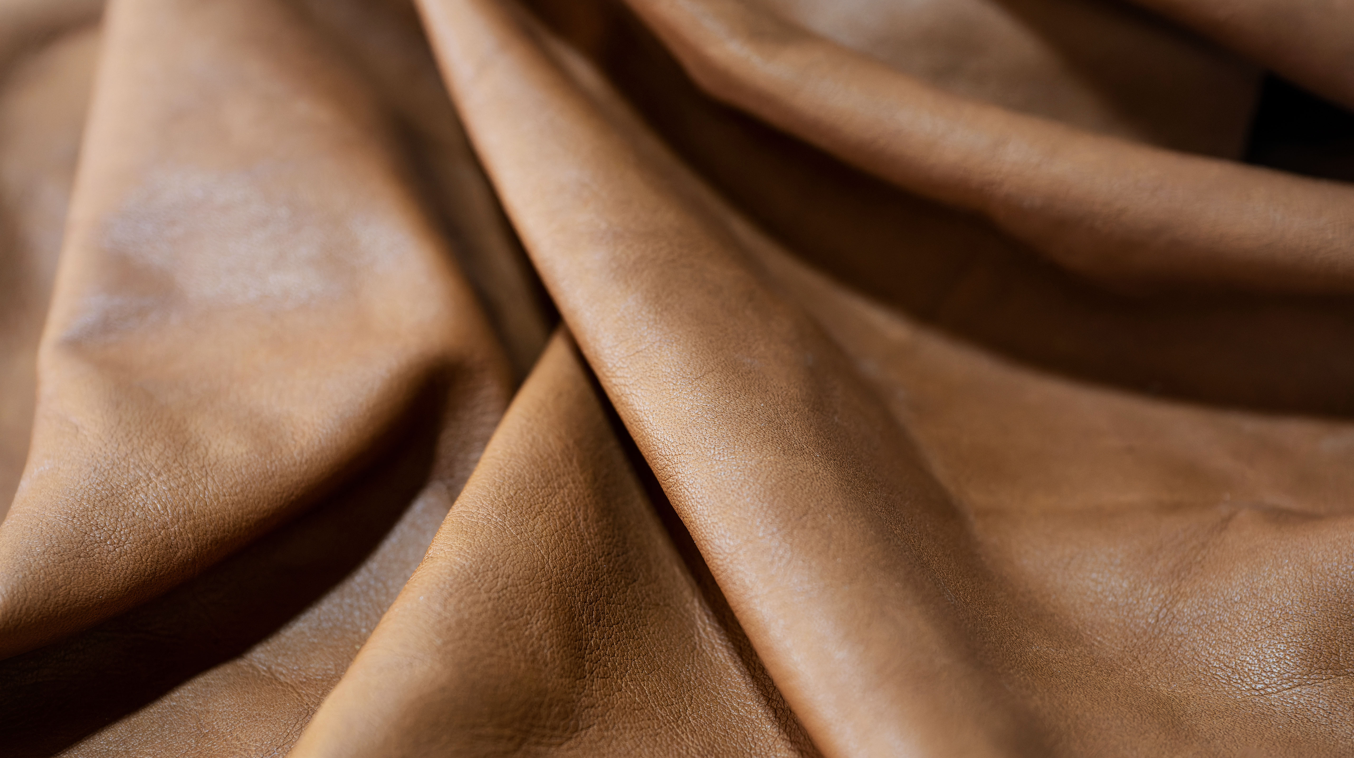 Soft leather laying in relaxed folds, illustrating the supple drape compared between Clemence and Negonda leathers