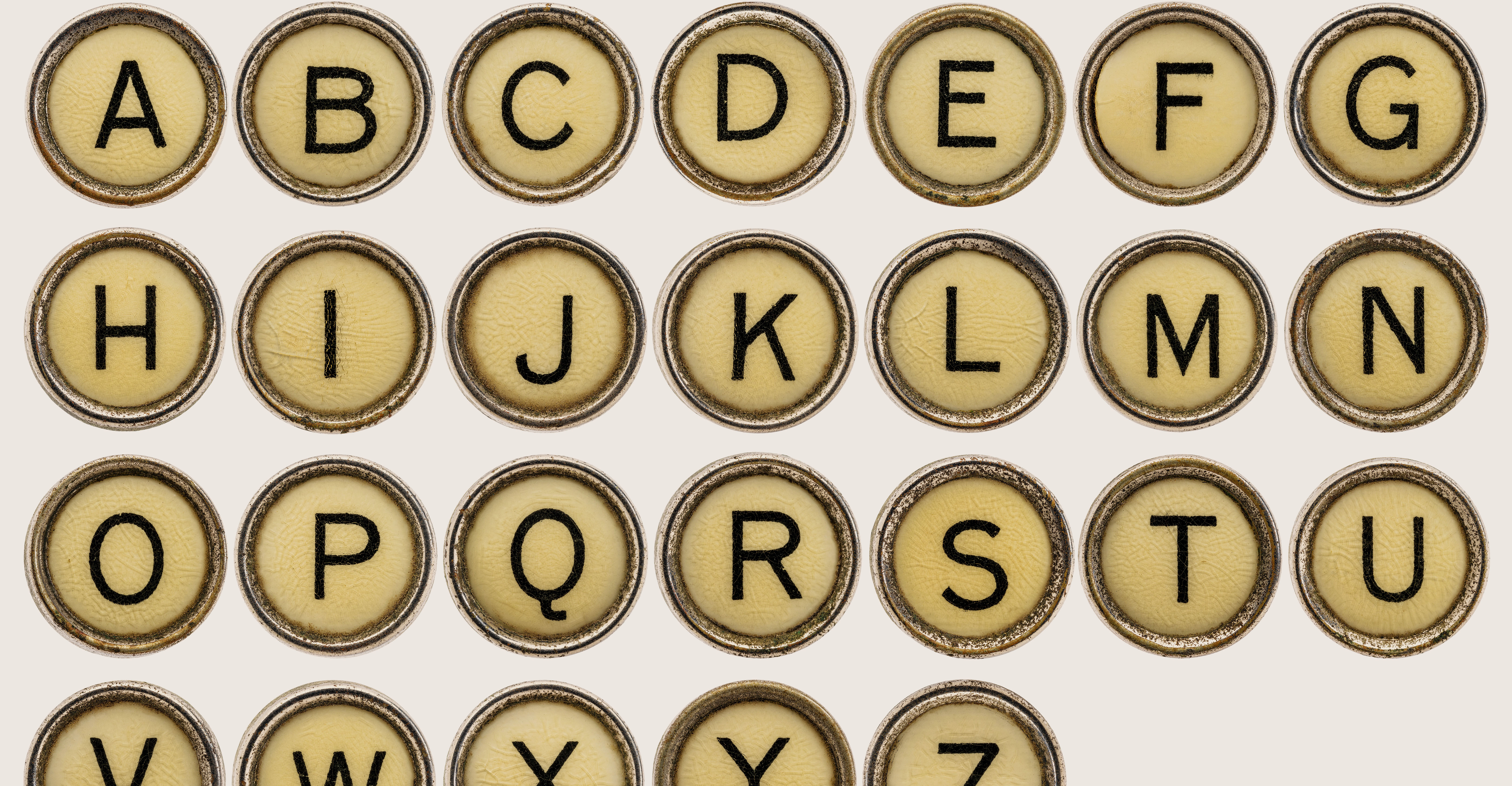 Close-up of alphabet lettering, representing the letter-based year code system used in Hermes date stamps