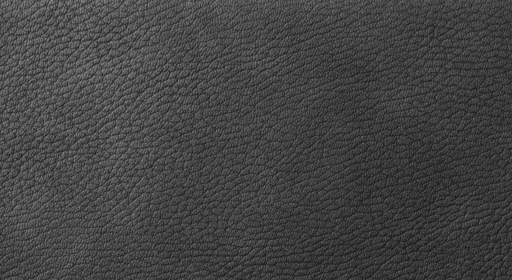 Close-up of textured grain leather, illustrating the structure compared between Togo and Chevre Mysore for a structured bag