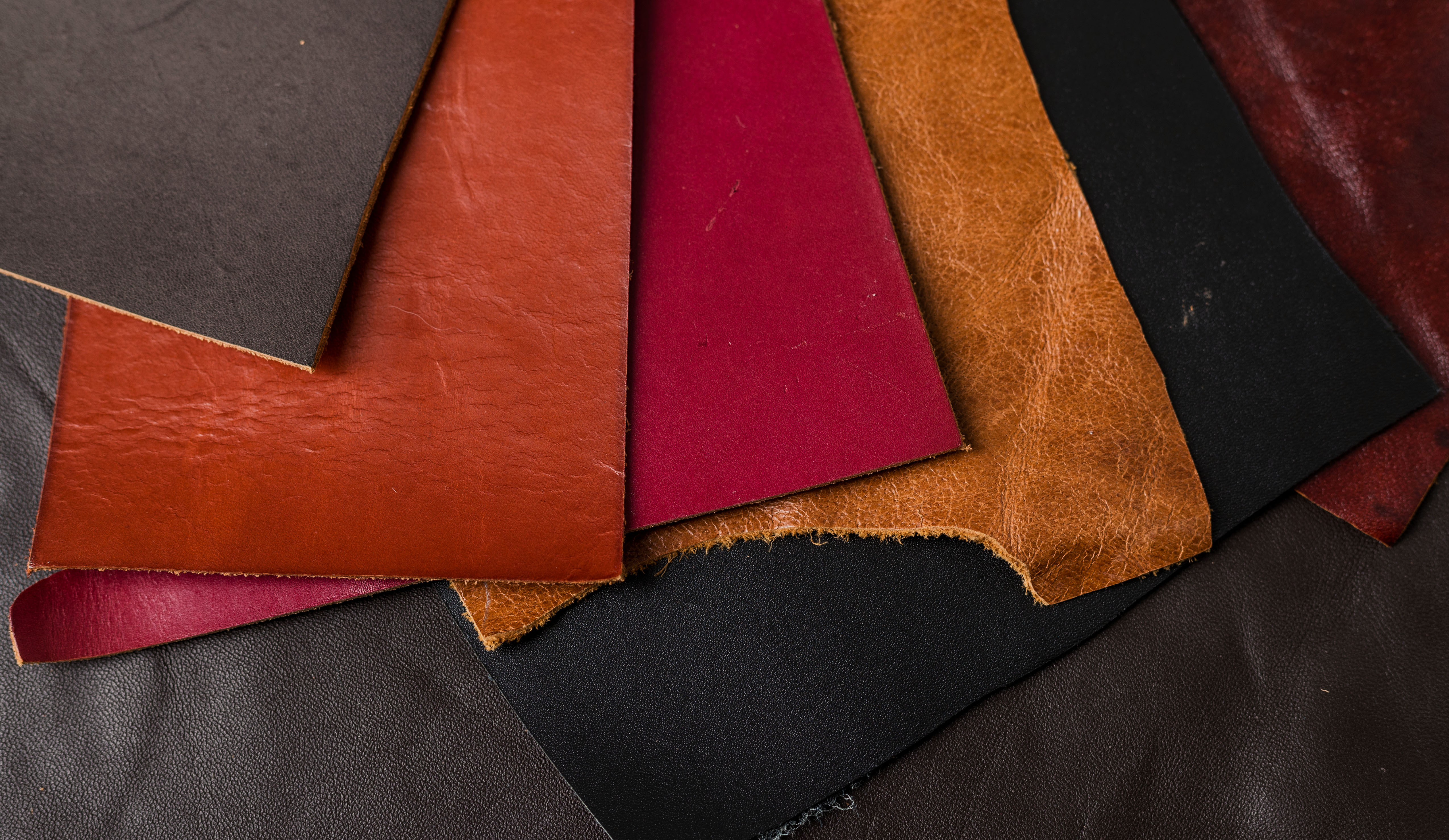 Close-up of warm-toned leather grain, illustrating the color shift Togo leather develops over time