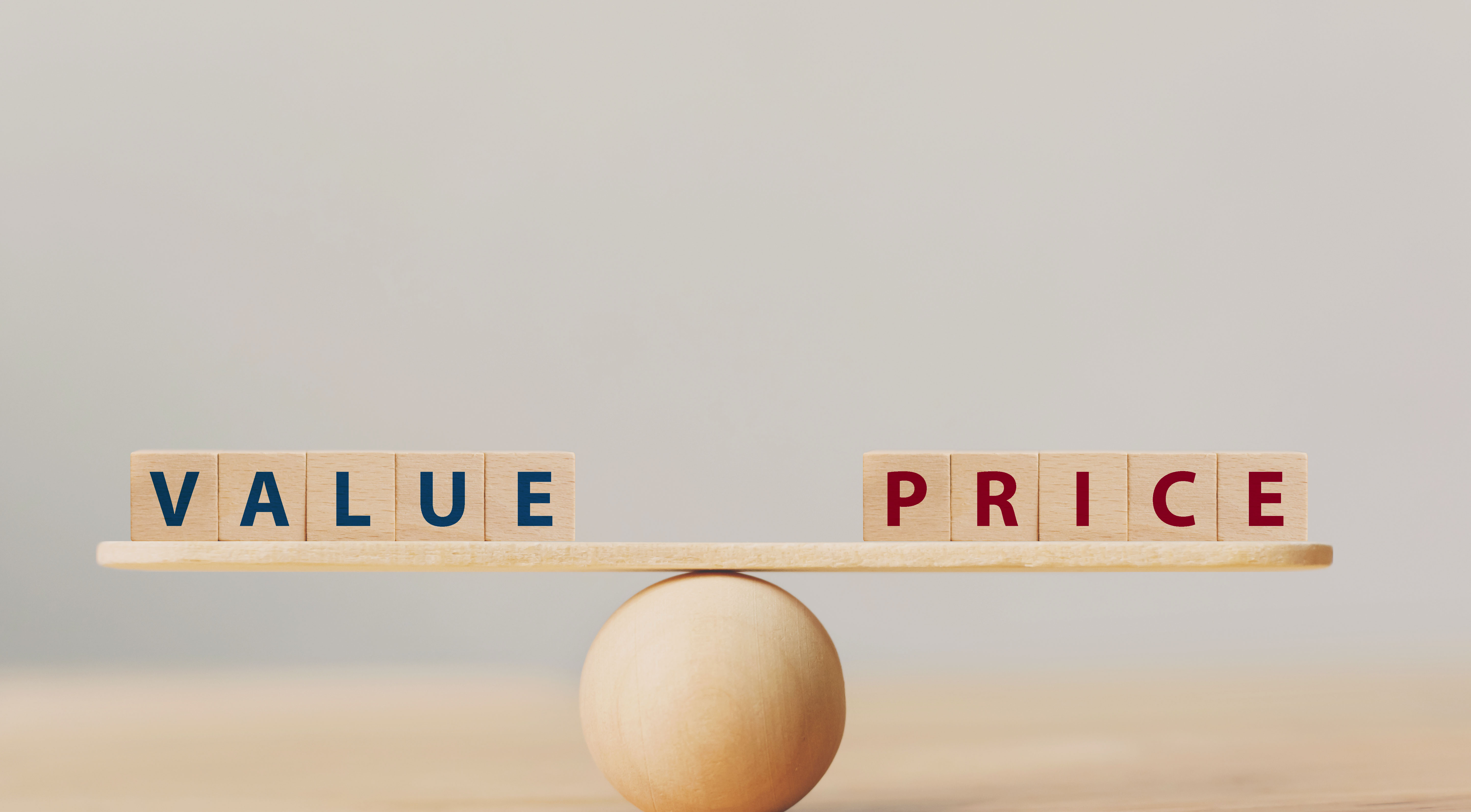 A wooden balance scale weighing value against price, representing the true cost comparison between boutique and reseller
