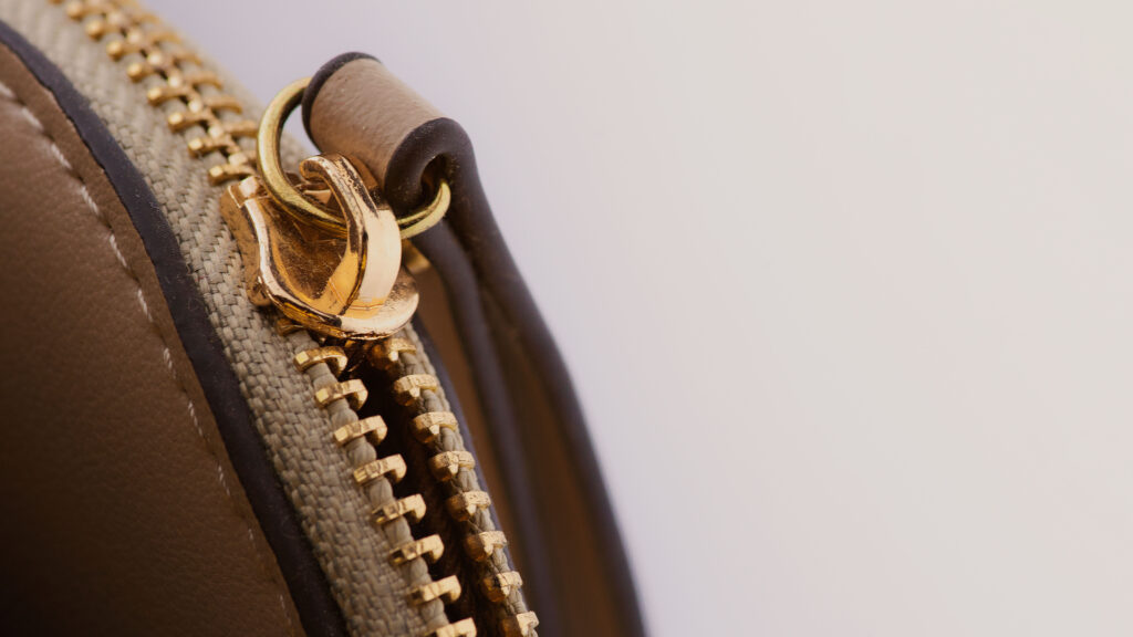 Hermes Zipper Pull Alignment and Weight: Full Authentication Guide Close-up of a handbag zipper pull and hardware